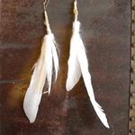 feather and felted earrings with gold wiring 
